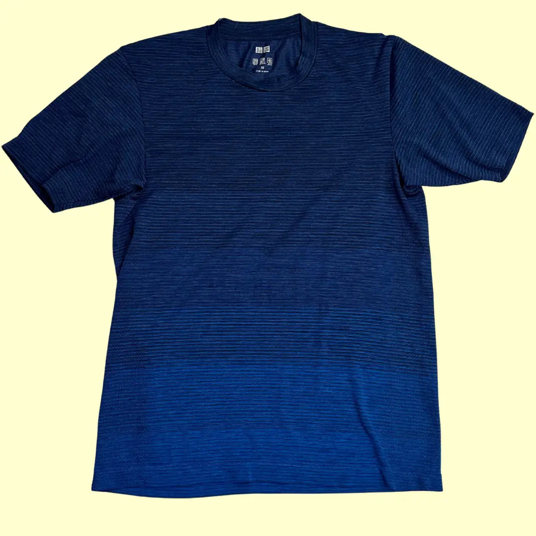 Uniqlo Men’s Performance T-shirt in navy blue with subtle horizontal stripe texture