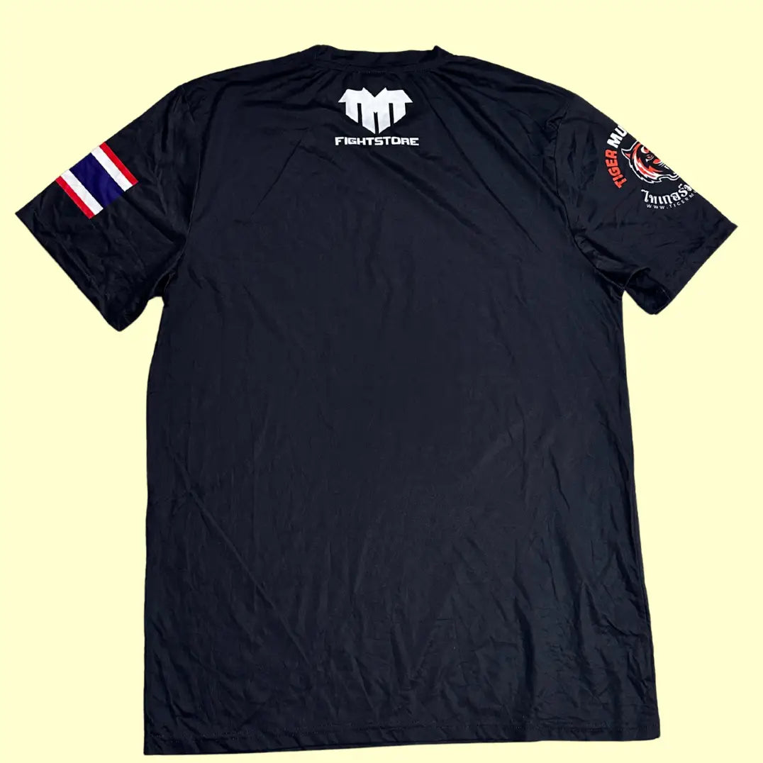 Tiger Muay Thai Training T-shirt in black with bold front tiger logo and Thai script.