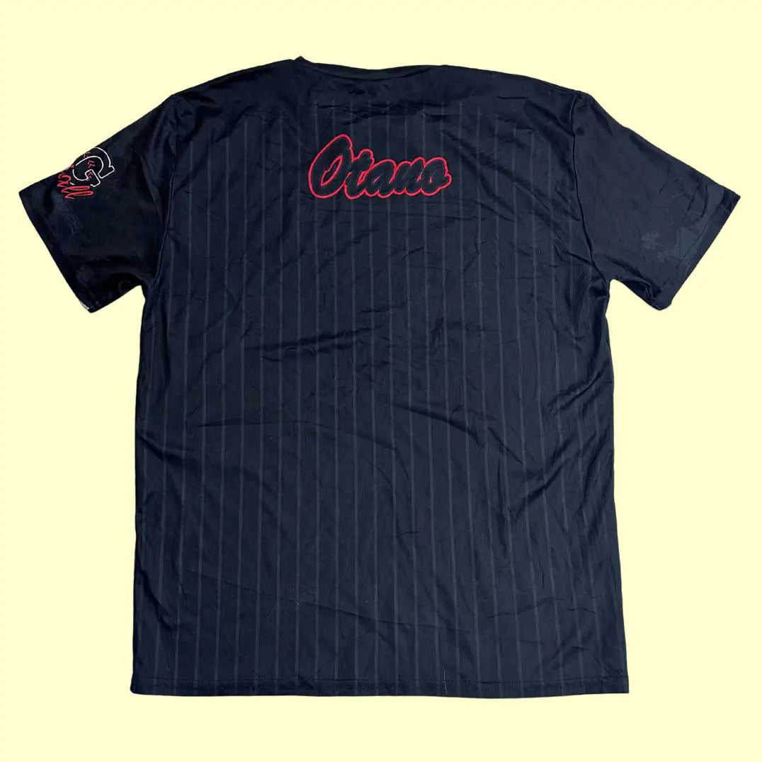 A stylish black jersey tee with a pinstripe design and bold red “Dirty Queens” lettering on the front