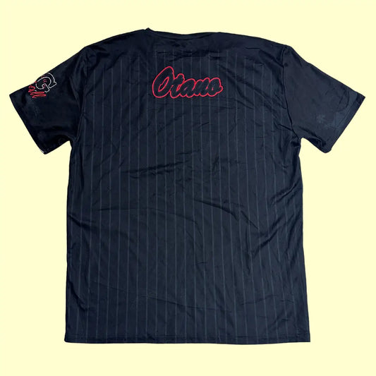 A stylish black jersey tee with a pinstripe design and bold red “Dirty Queens” lettering on the front