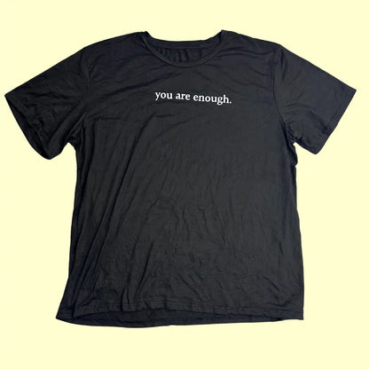 A meaningful and stylish black graphic tee with uplifting messages
