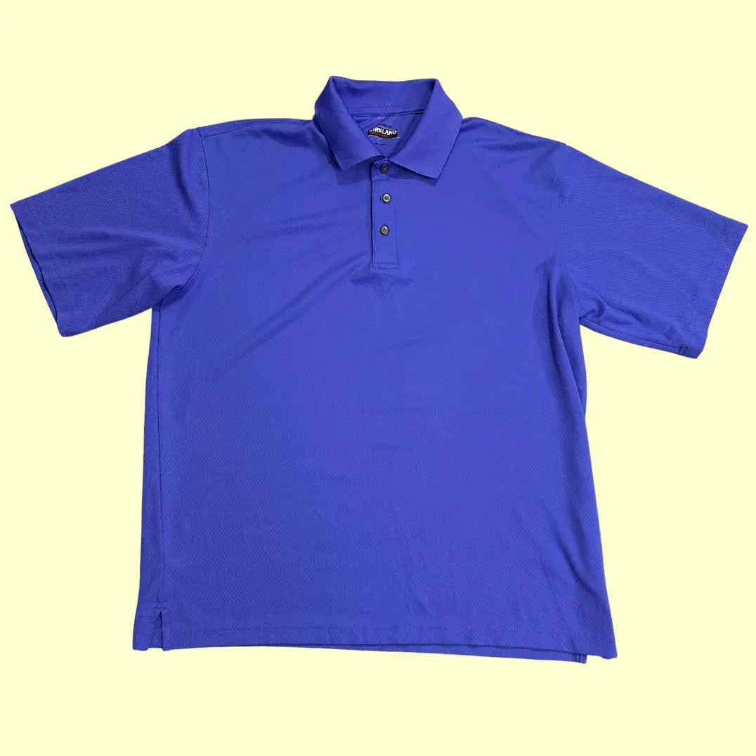 Kirkland Signature Performance Polo Shirt in royal blue.