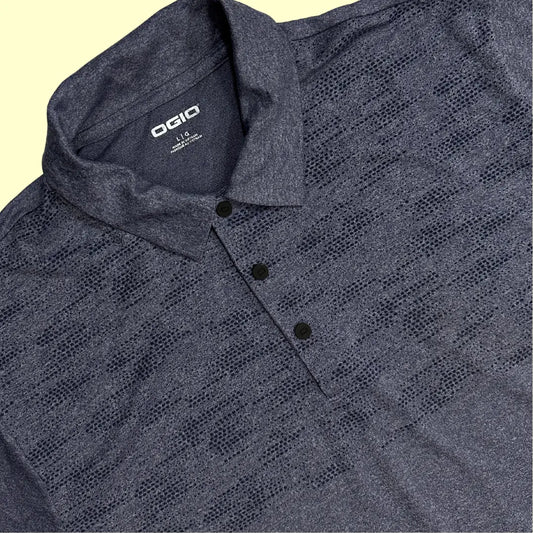 OGIO Performance Polo Shirt in dark heather grey with a subtle patterned design across the chest.