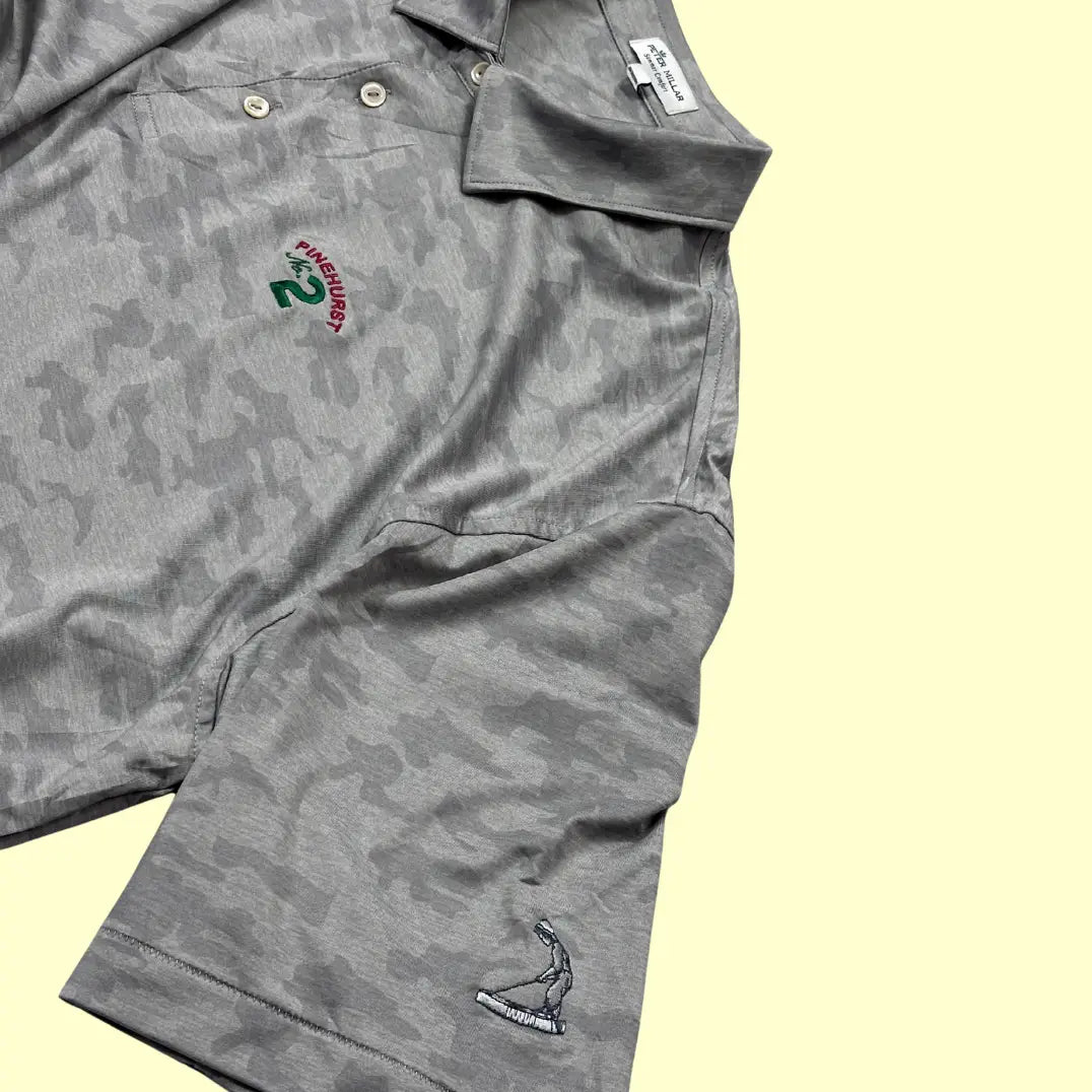Peter Millar performance polo in grey camo pattern.
