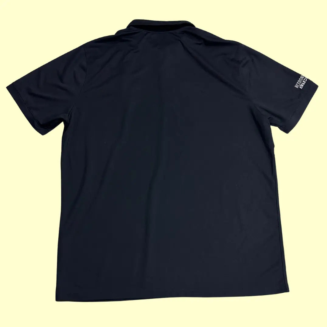 Nike Dri-FIT black polo shirt with RS crest embroidery.