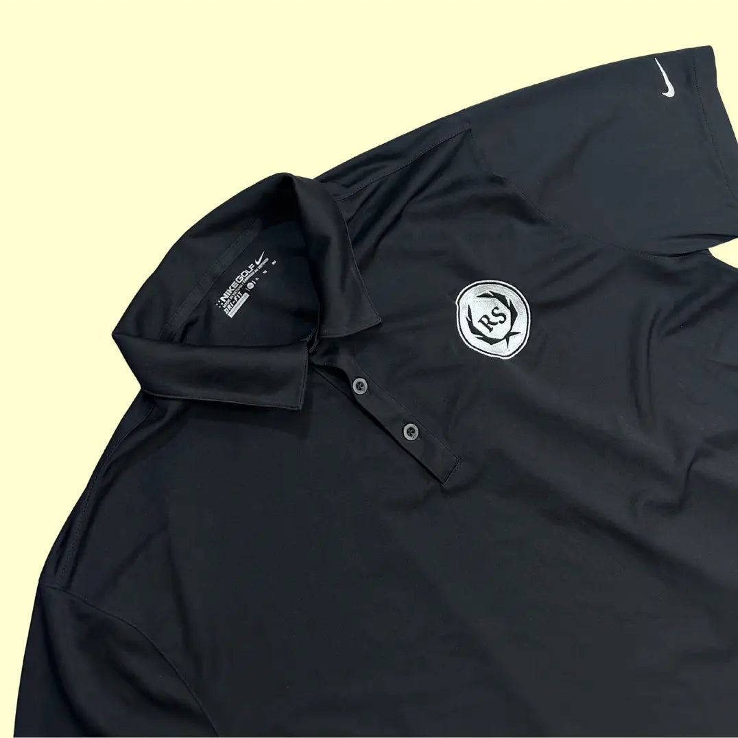 Nike Dri-FIT black polo shirt with RS crest embroidery.