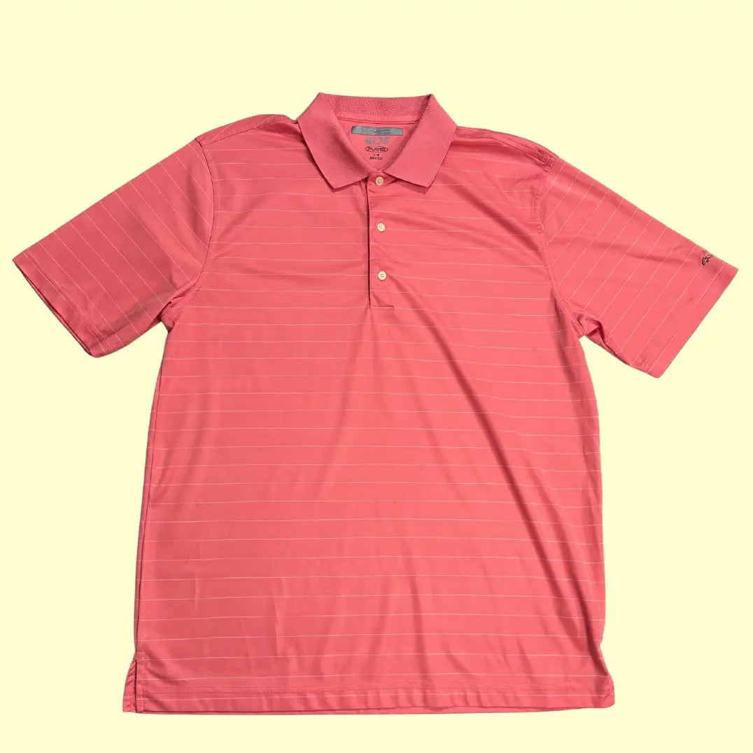 Greg Norman ML75 PlayDry Polo Shirt in coral pink with subtle stripe design.