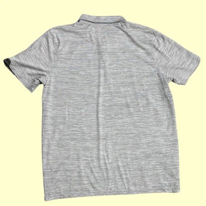 Oakley Performance Polo Shirt in light gray with subtle stripe design.