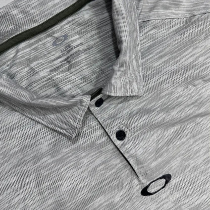 Oakley Performance Polo Shirt in light gray with subtle stripe design.