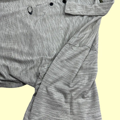 Oakley Performance Polo Shirt in light gray with subtle stripe design.
