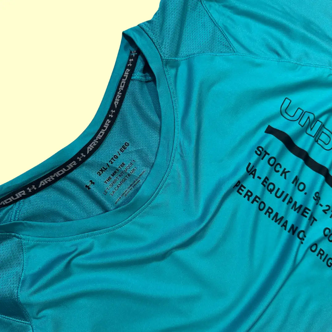Under Armour Performance Tee in teal blue with a black lower panel