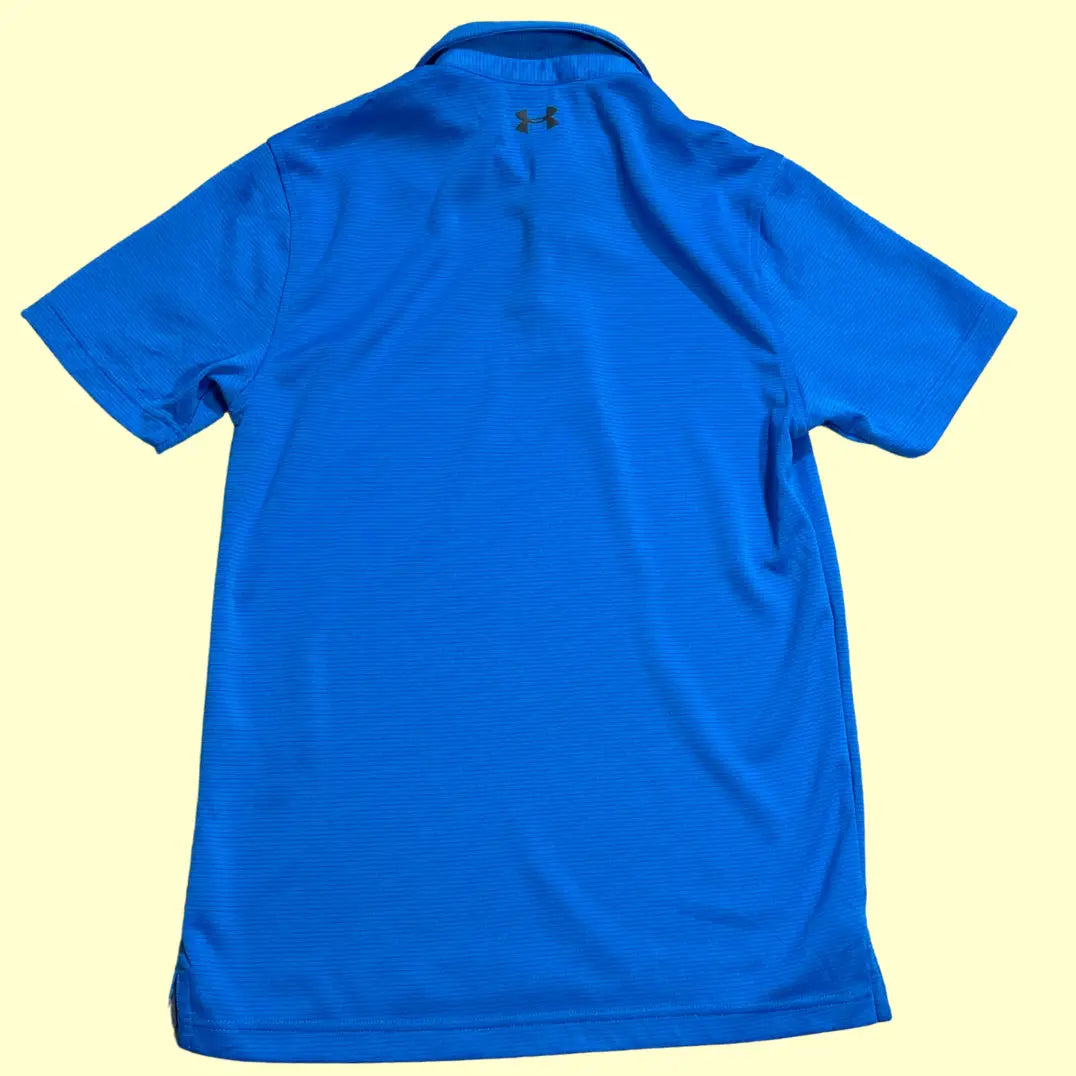 Under Armour polo shirt in vibrant royal blue.
