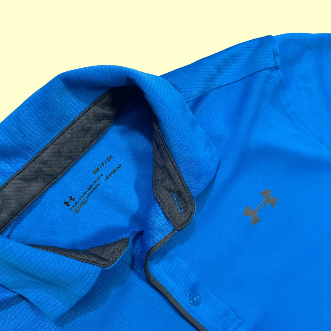 Under Armour polo shirt in vibrant royal blue.