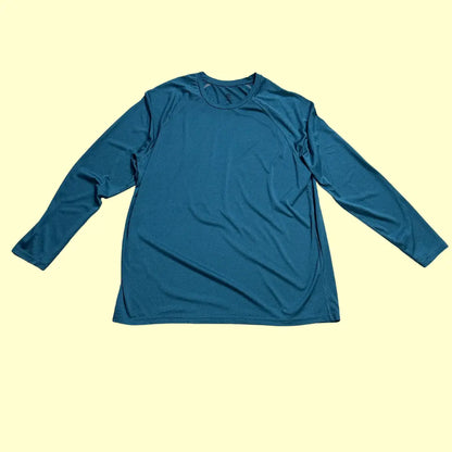 Champion long-sleeve performance shirt in teal blue.