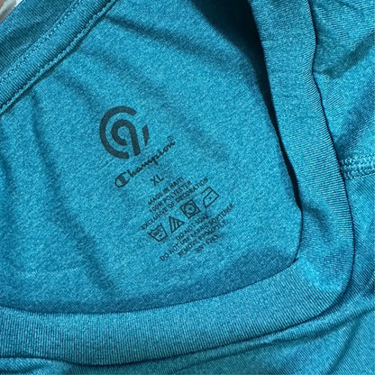 Champion long-sleeve performance shirt in teal blue.