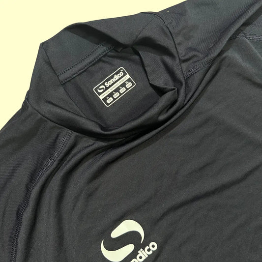 Performance Sondico long-sleeve compression top in black.