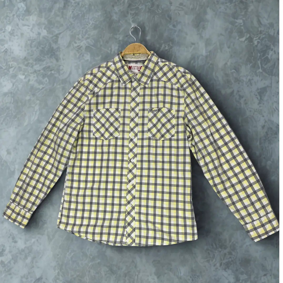Mustang ® . A brand known for its denim and quality casual wear. It features a bold and attractive plaid pattern in a distinctive color combination of lemon yellow, charcoal grey, and white.