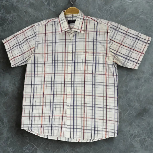 LIKAS ®. It features a clean white background with a sharp, open windowpane plaid pattern.