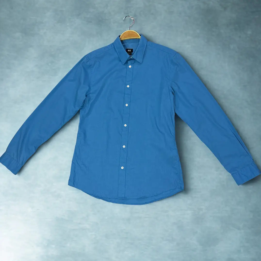H&M ®. It comes in a striking and vibrant solid blue colour.
