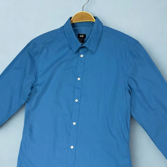 H&M ®. It comes in a striking and vibrant solid blue colour.