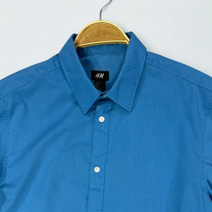 H&M ®. It comes in a striking and vibrant solid blue colour.