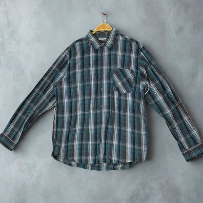 SOUTHERN ®. It features a handsome and versatile plaid pattern in a cool-toned color palette of teal, brown, black, and white.