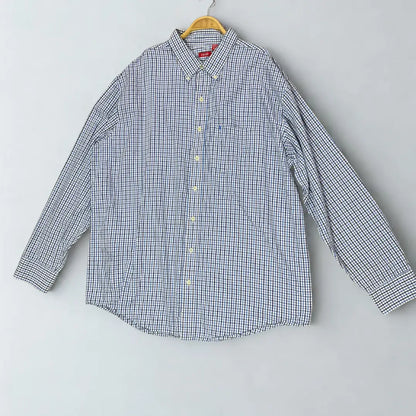 IZOD ®. It features a timeless and sharp graph check pattern, combining shades of blue and black on a crisp white background.