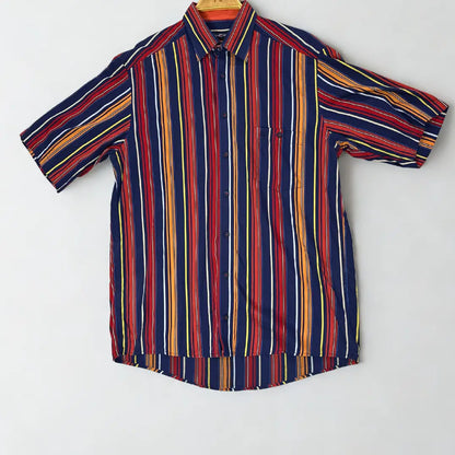 CASA MODA ®. It features a bold, multi-colored vertical stripe pattern in a striking combination of navy blue, red, orange, yellow, and white.