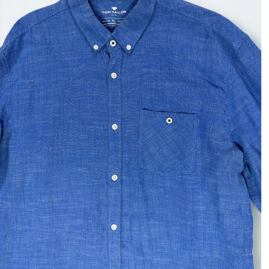 Tom Tailor ®. It features a beautiful blue