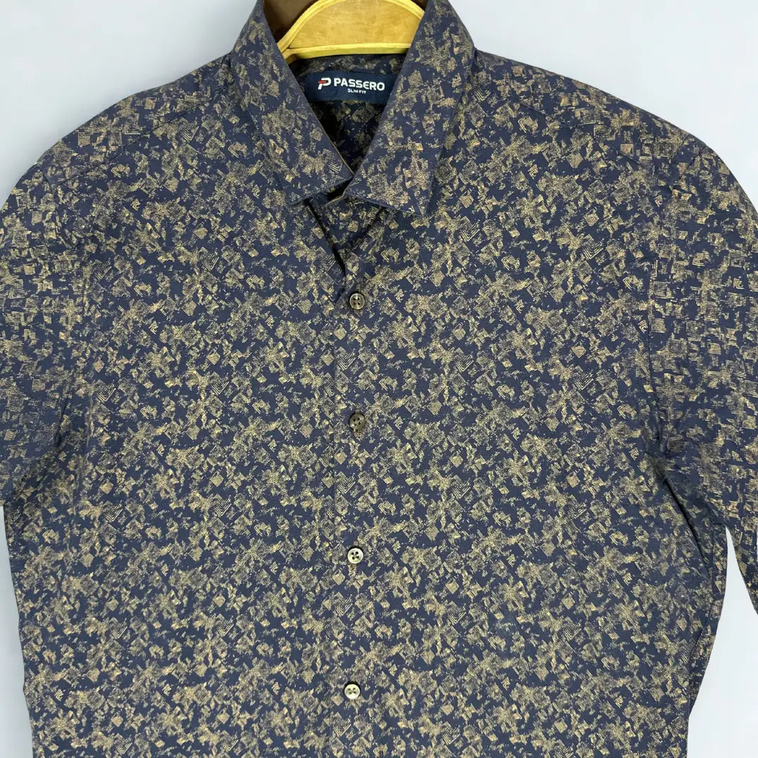 PASSERO ®. It features a dark, moody base color (charcoal) overlaid with a striking gold or khaki