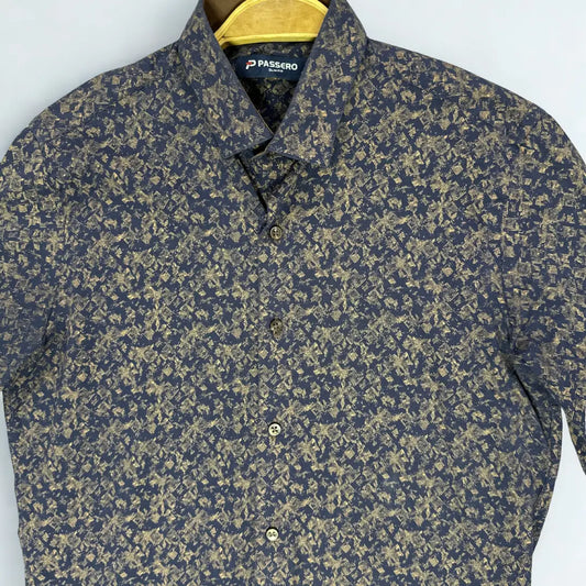 PASSERO ®. It features a dark, moody base color (charcoal) overlaid with a striking gold or khaki