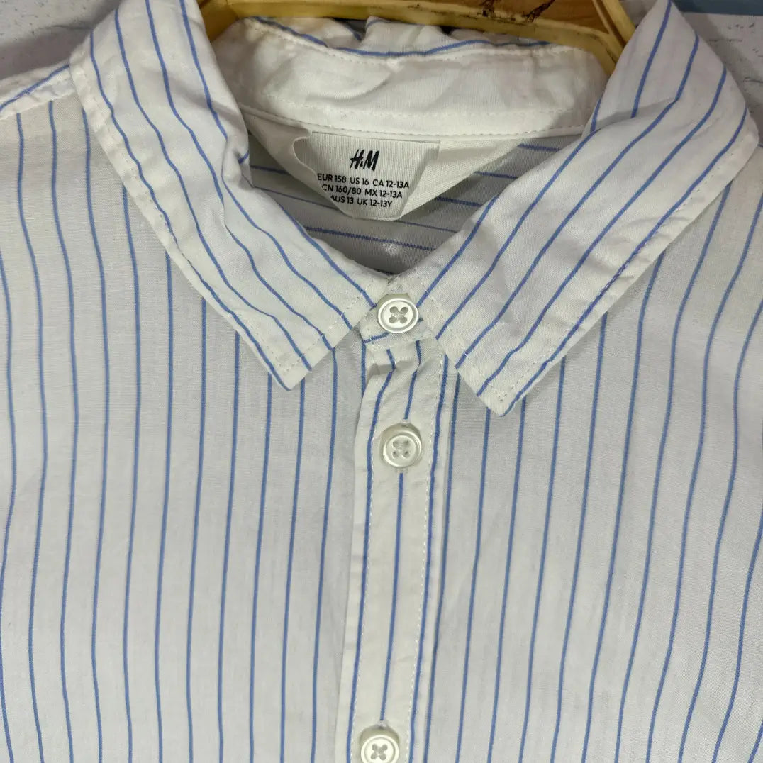 H & M.® It features a timeless and versatile vertical stripe pattern