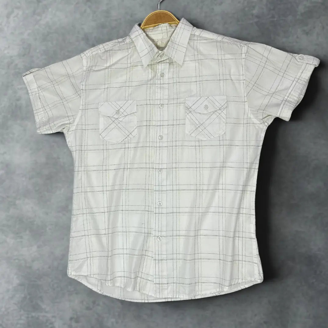 MUCH MORE ®It features a modern take on a classic plaid design.