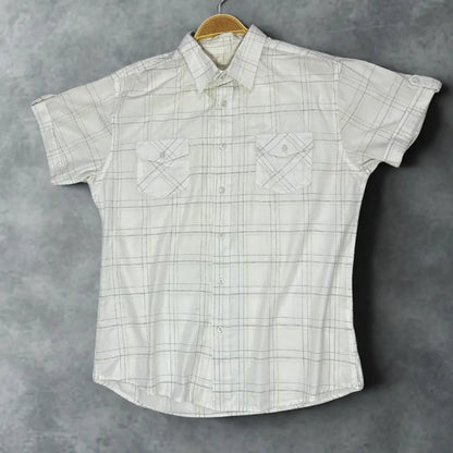 MUCH MORE ®It features a modern take on a classic plaid design.