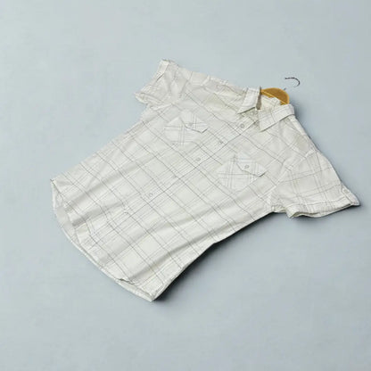 MUCH MORE ®It features a modern take on a classic plaid design.