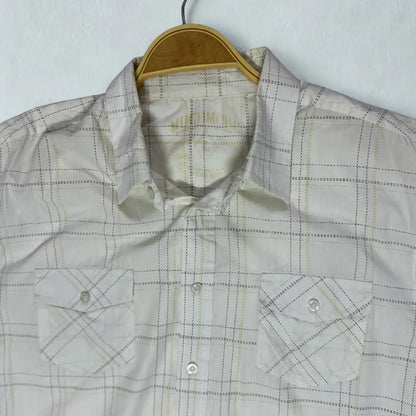 MUCH MORE ®It features a modern take on a classic plaid design.